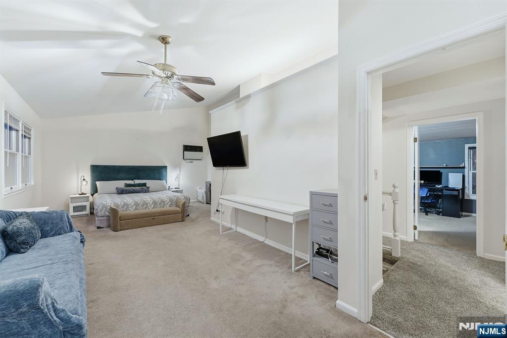 31 West Street Closter, NJ 07624 - Photo 9 of 18 a living room with furniture and a flat screen tv