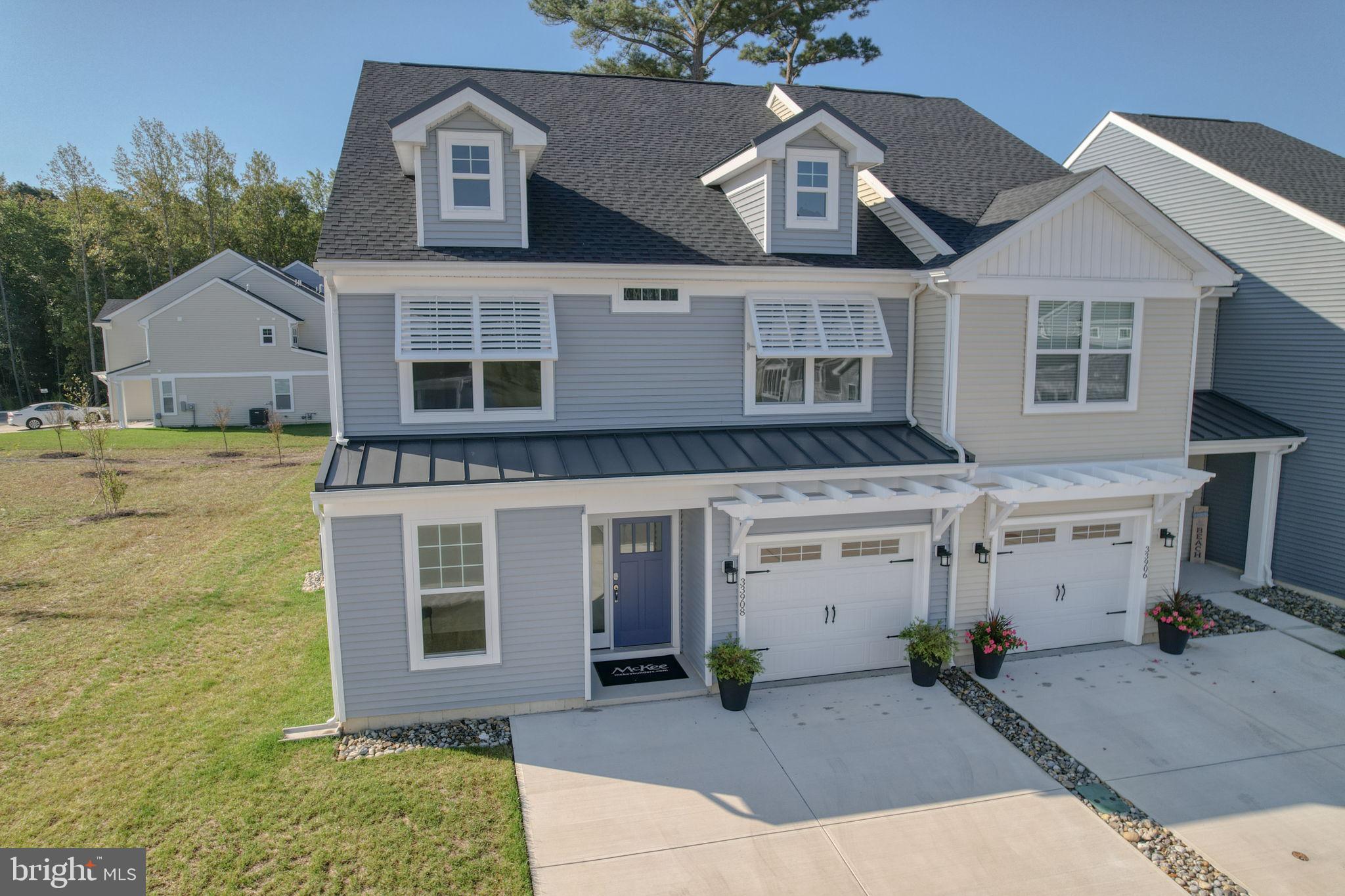 a front view of a house with a garage