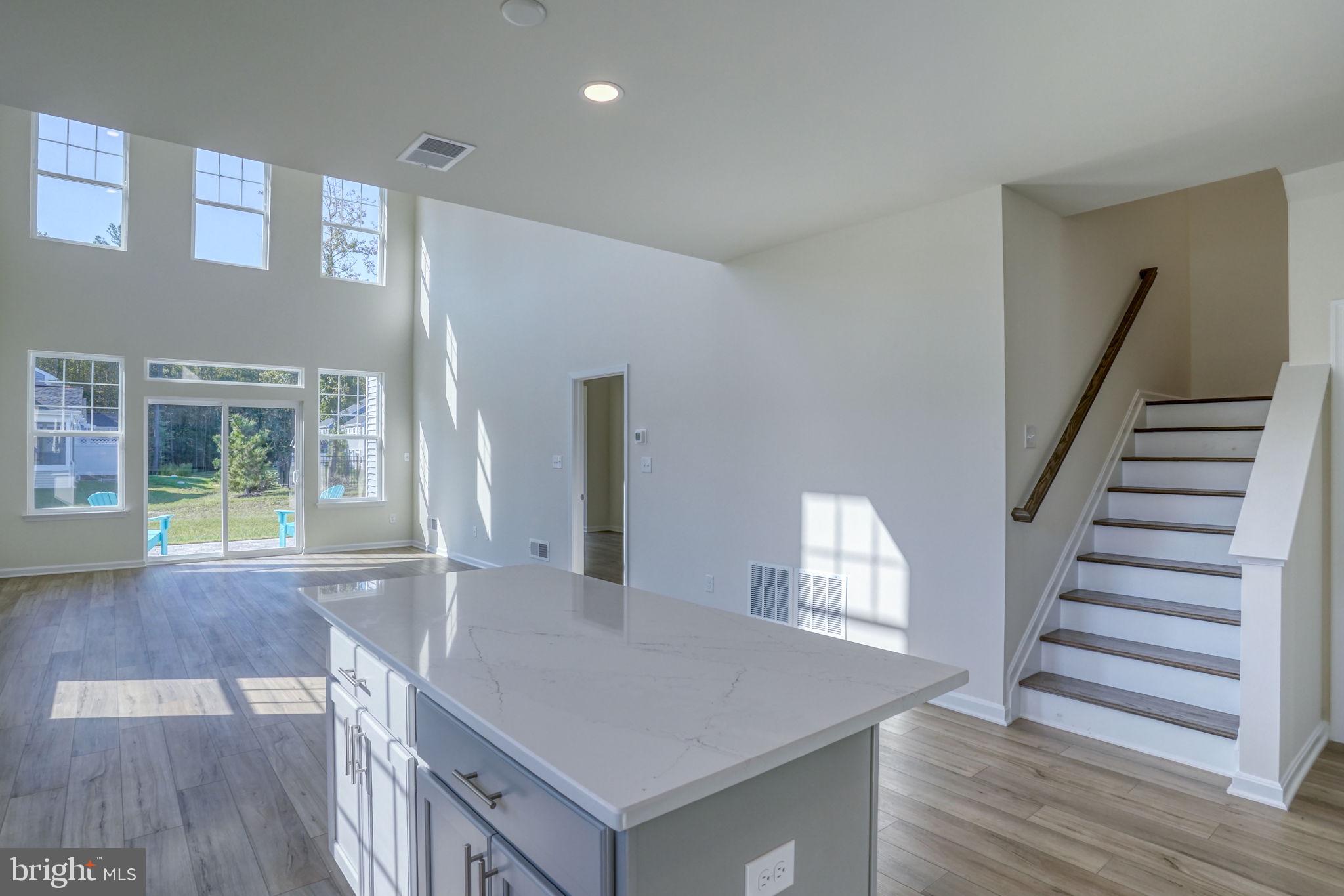 33908 Ardwell Road Frankford, DE 19945 - Photo 17 of 44 a view of entryway and hall with wooden floor