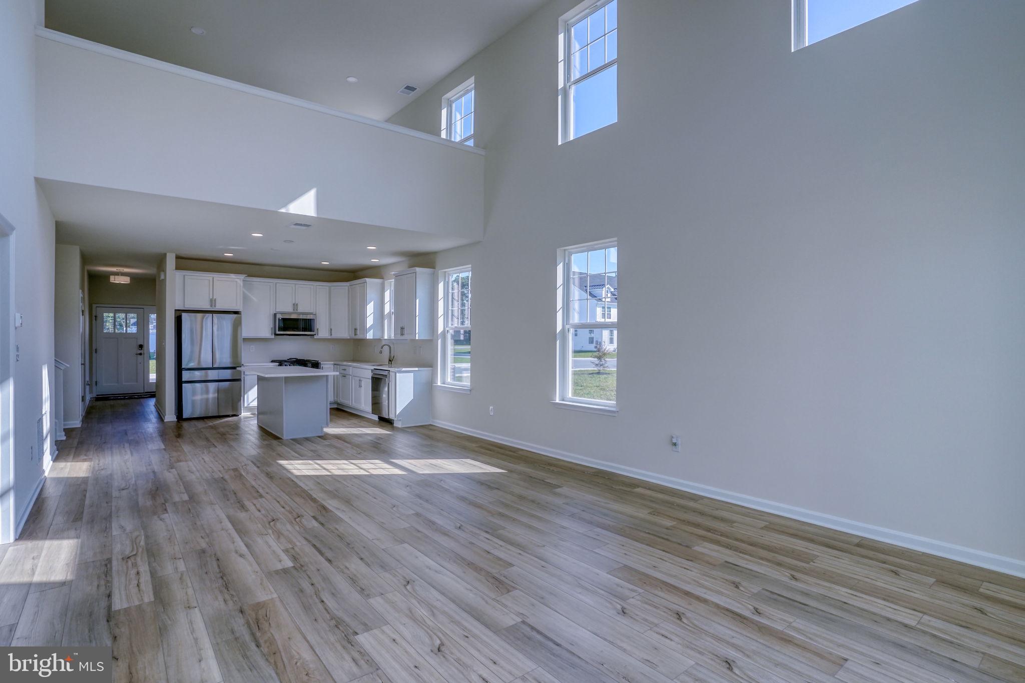 33908 Ardwell Road Frankford, DE 19945 - Photo 20 of 44 a living room with furniture and large wooden floor