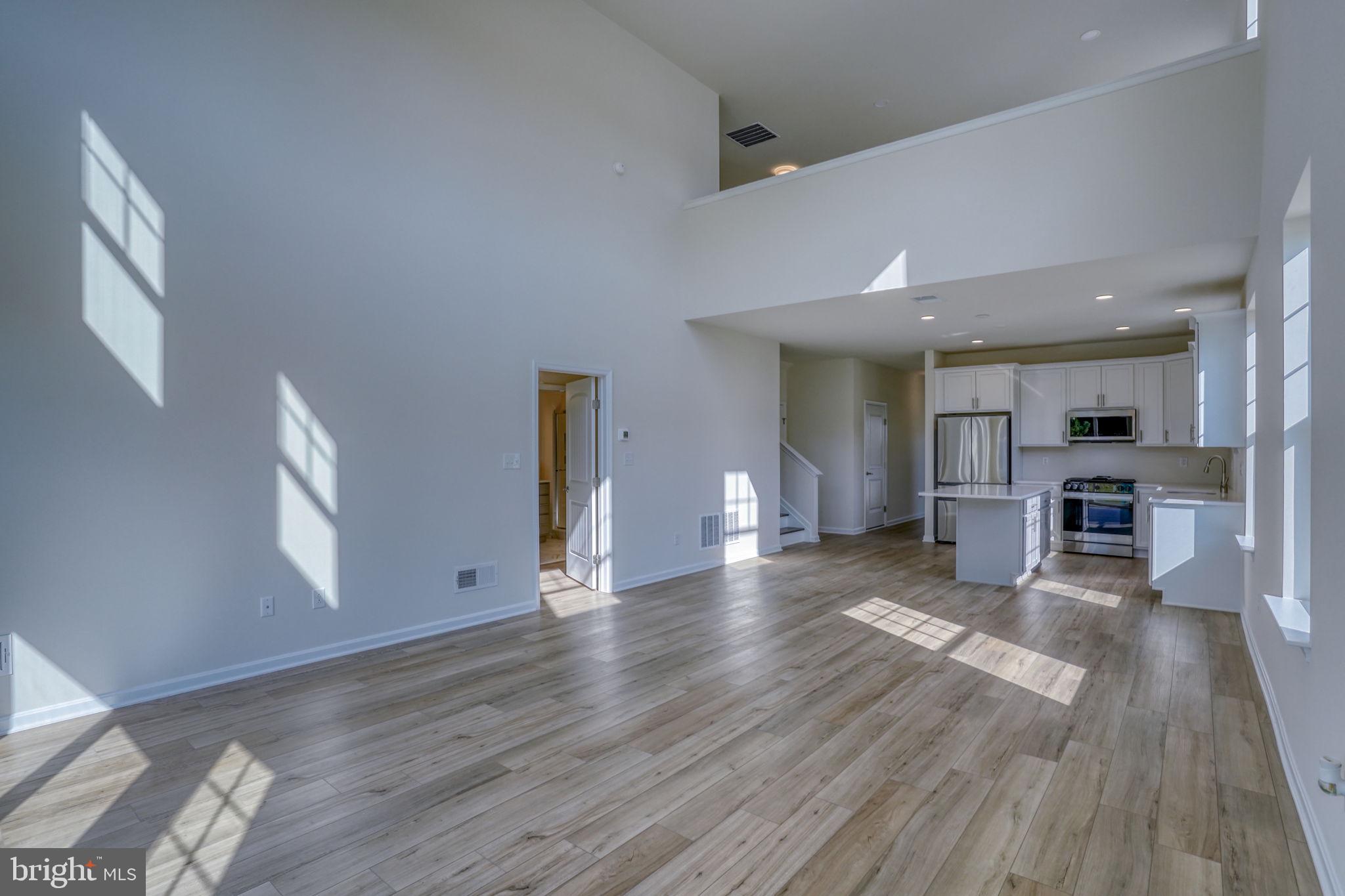 33908 Ardwell Road Frankford, DE 19945 - Photo 21 of 44 a view of kitchen with furniture and wooden floor