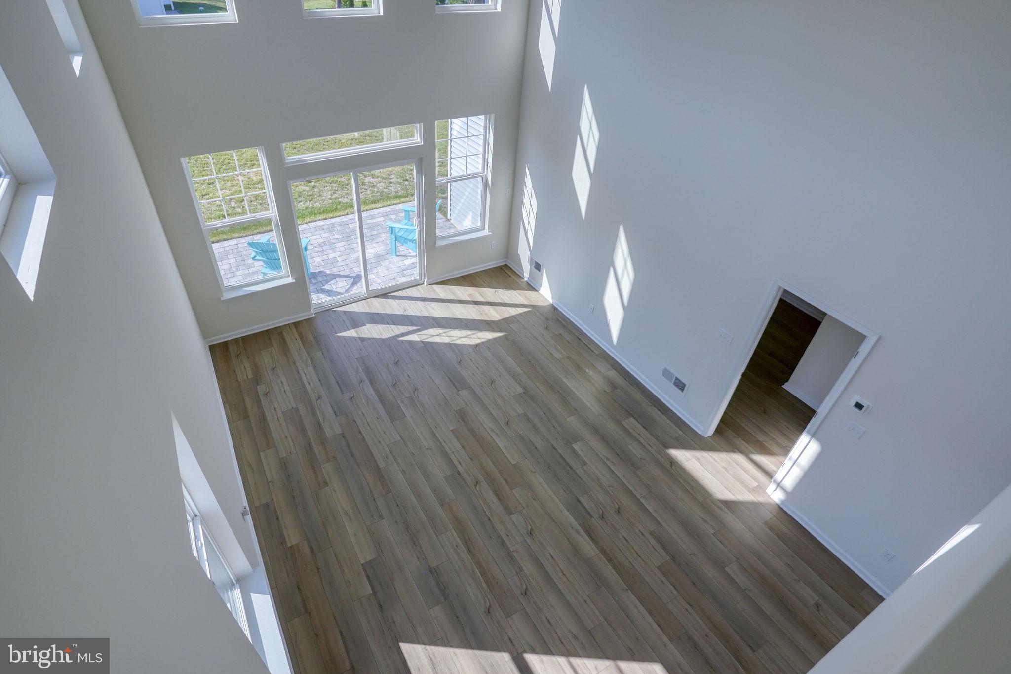 33908 Ardwell Road Frankford, DE 19945 - Photo 26 of 44 wooden floor in an empty room with a window