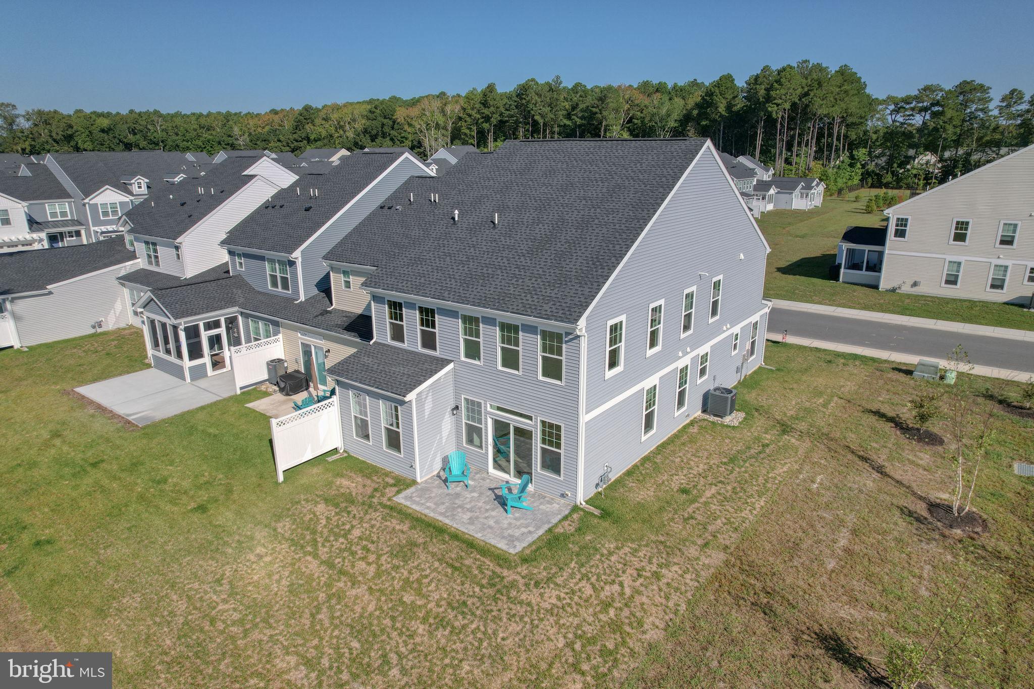 33908 Ardwell Road Frankford, DE 19945 - Photo 34 of 44 an aerial view of a house with a yard table and chairs