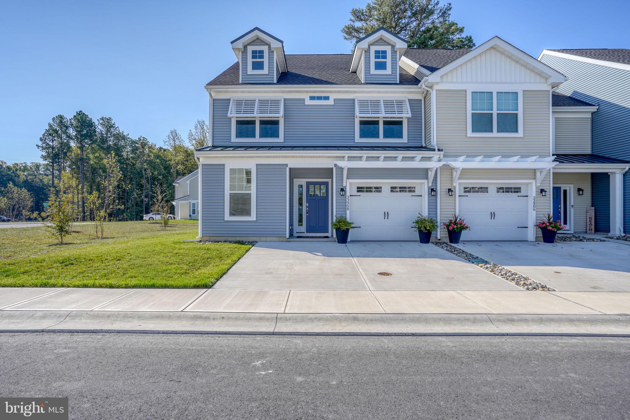 33908 Ardwell Road Frankford, DE 19945 - Photo 6 of 44 a front view of a house with a yard