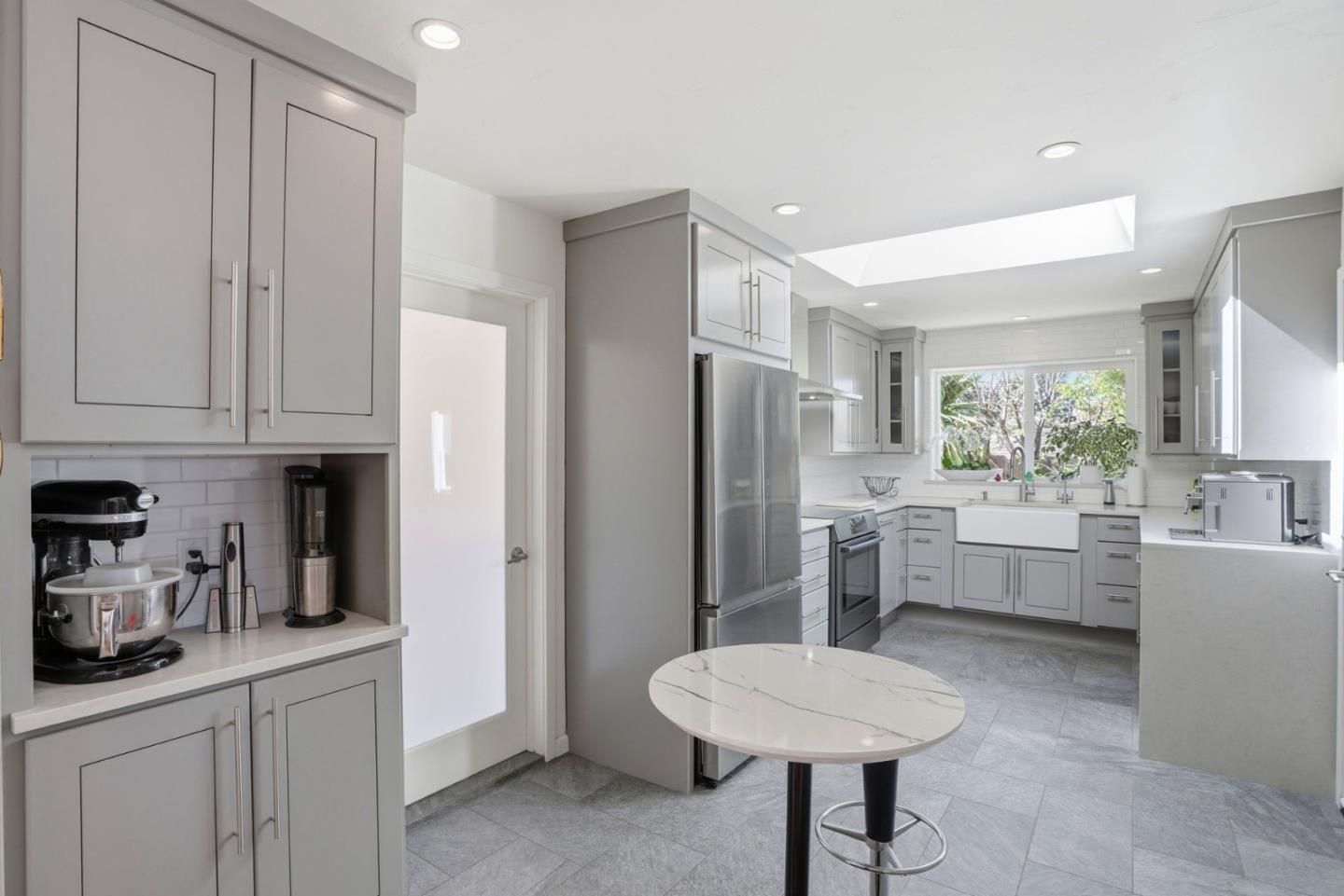 329 Stuart Avenue Pacific Grove, CA 93950 - Photo 1 of 33 a kitchen with stainless steel appliances a refrigerator and a sink