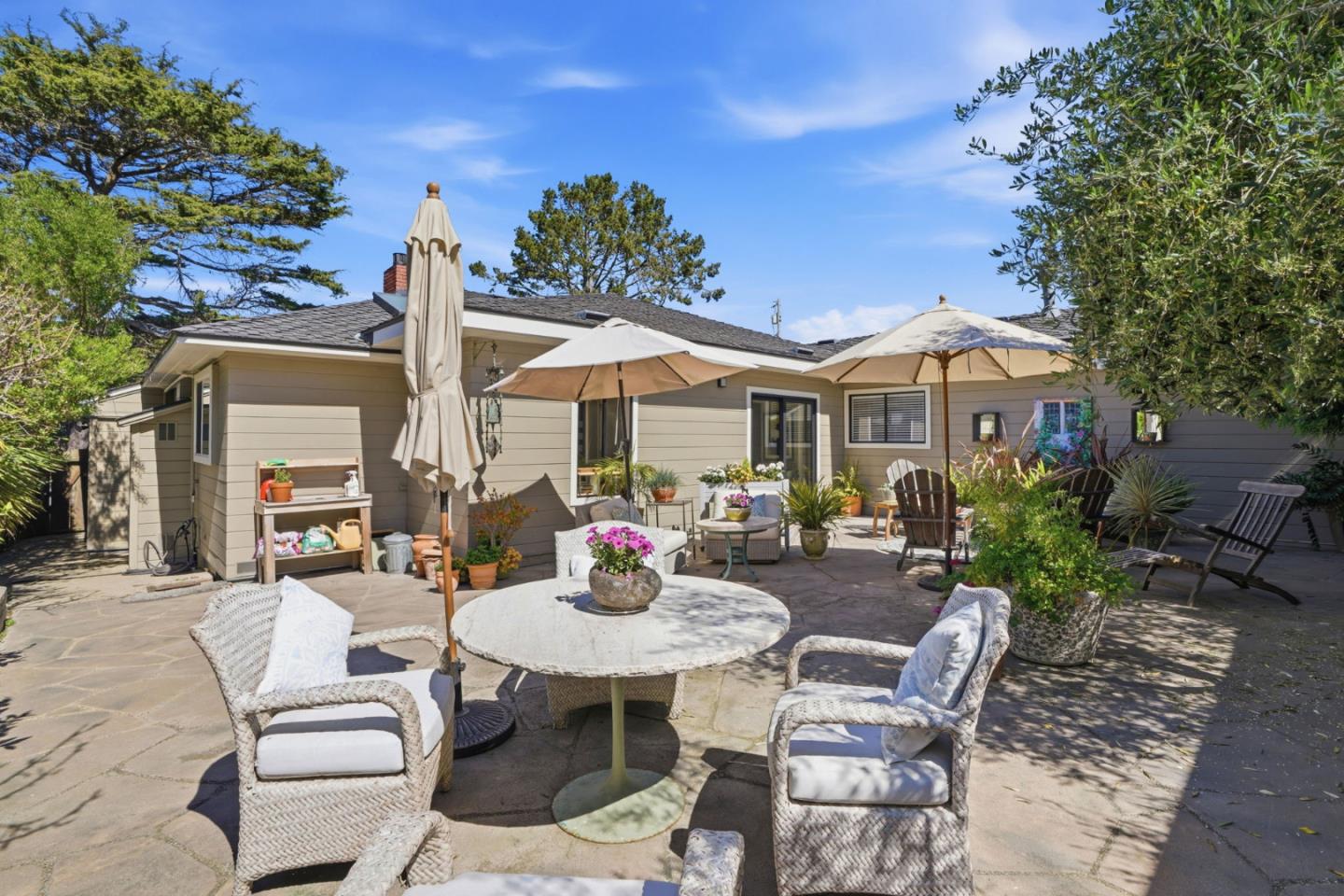 329 Stuart Avenue Pacific Grove, CA 93950 - Photo 12 of 33 a view of a patio with table and chairs and potted plants