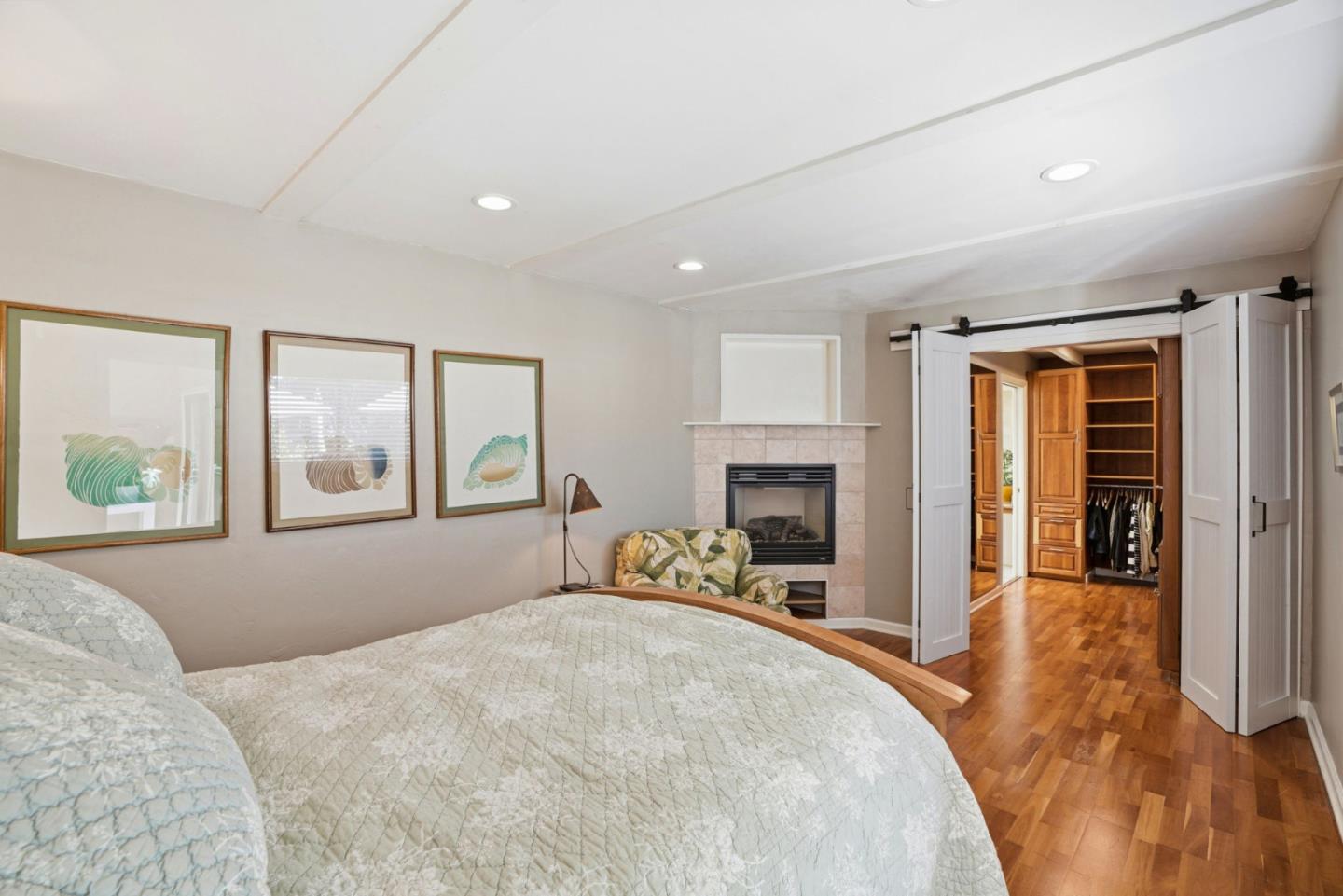 329 Stuart Avenue Pacific Grove, CA 93950 - Photo 15 of 33 a bedroom with a large bed and a window