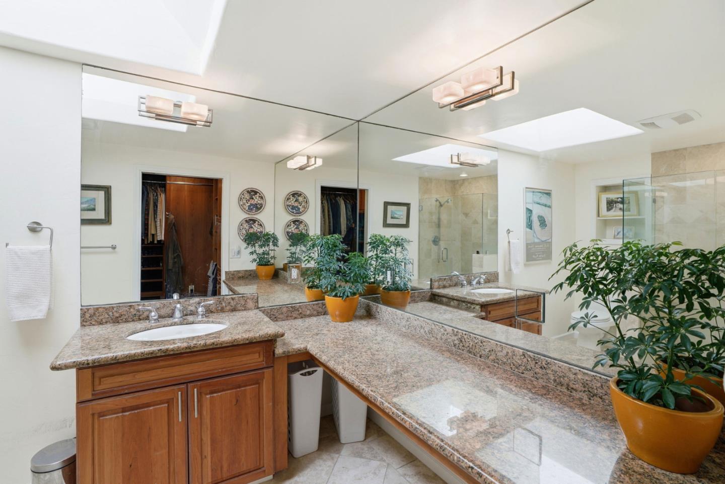 329 Stuart Avenue Pacific Grove, CA 93950 - Photo 17 of 33 a large bathroom with a granite countertop sink and a large mirror