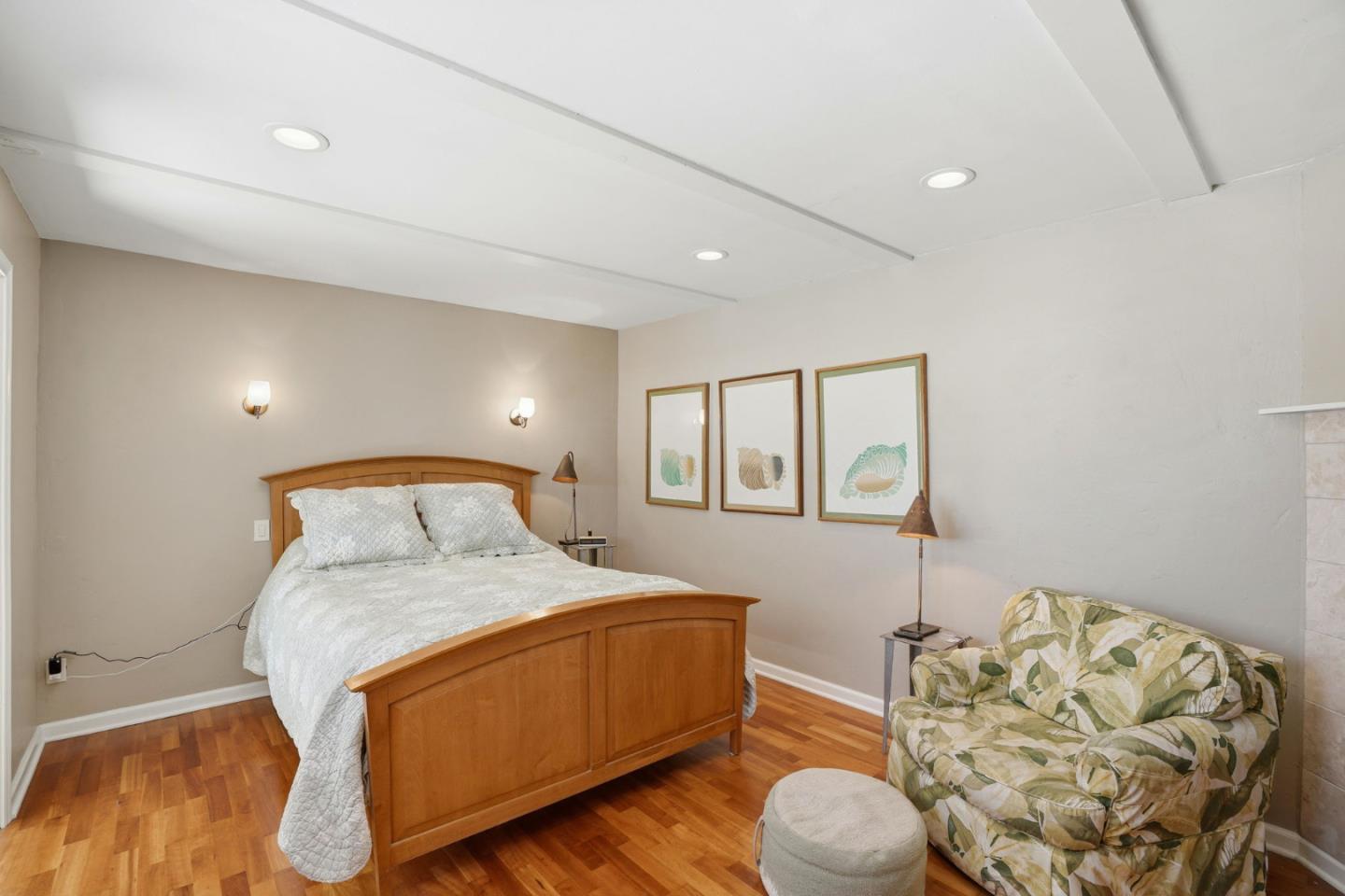 329 Stuart Avenue Pacific Grove, CA 93950 - Photo 18 of 33 a bedroom with a bed and a dresser