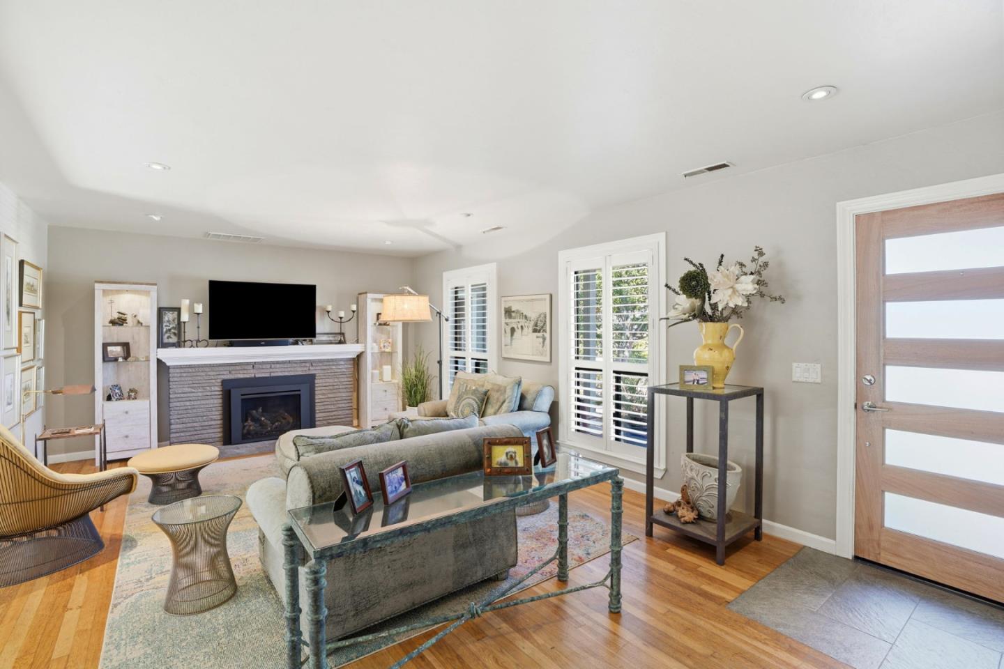 329 Stuart Avenue Pacific Grove, CA 93950 - Photo 2 of 33 a living room with furniture a fireplace and a flat screen tv