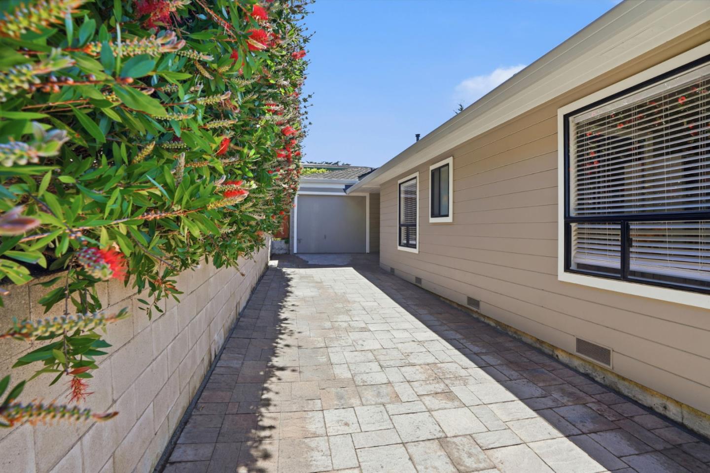 329 Stuart Avenue Pacific Grove, CA 93950 - Photo 27 of 33 a pathway of a house with a yard