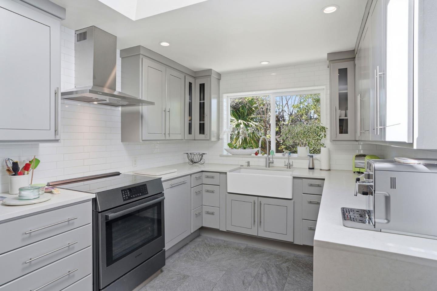 329 Stuart Avenue Pacific Grove, CA 93950 - Photo 3 of 33 a kitchen with a sink stove and cabinets