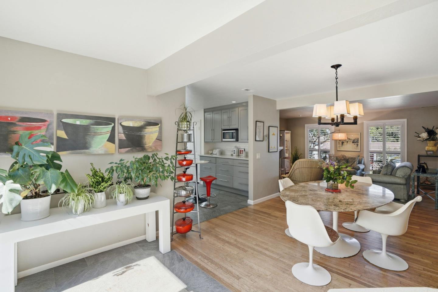 329 Stuart Avenue Pacific Grove, CA 93950 - Photo 31 of 33 a living room with furniture and a chandelier
