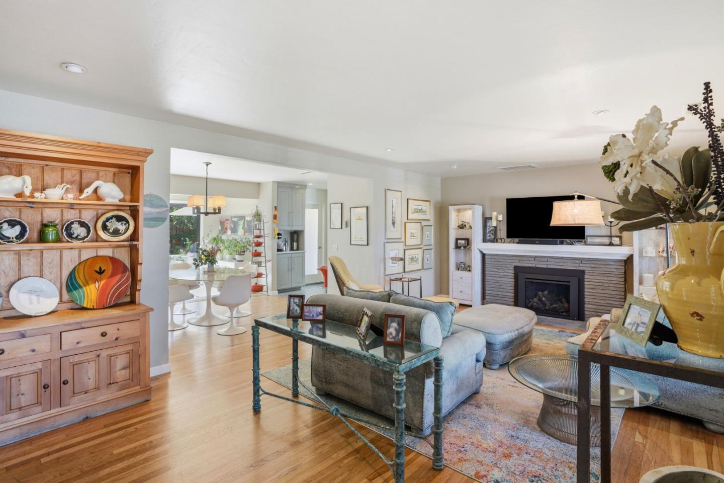 329 Stuart Avenue Pacific Grove, CA 93950 - Photo 6 of 33 a living room with furniture a fireplace and a flat screen tv