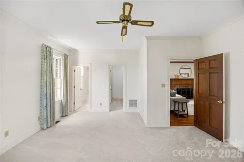 a view of empty room with ceiling fan
