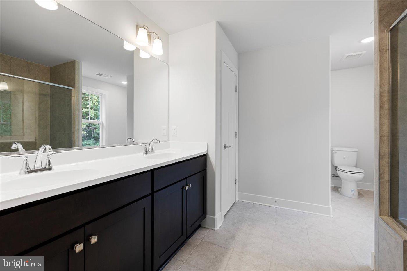 1 Indiantown Road King George, VA 22485 - Photo 31 of 43 Elegant Primary Bath w/ Tile Floor + Modern Light
