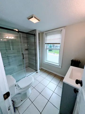 a bathroom with a sink and a shower