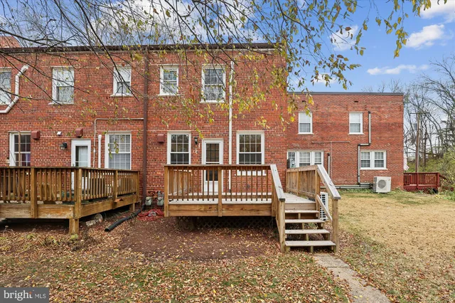 front view of a house with a fence