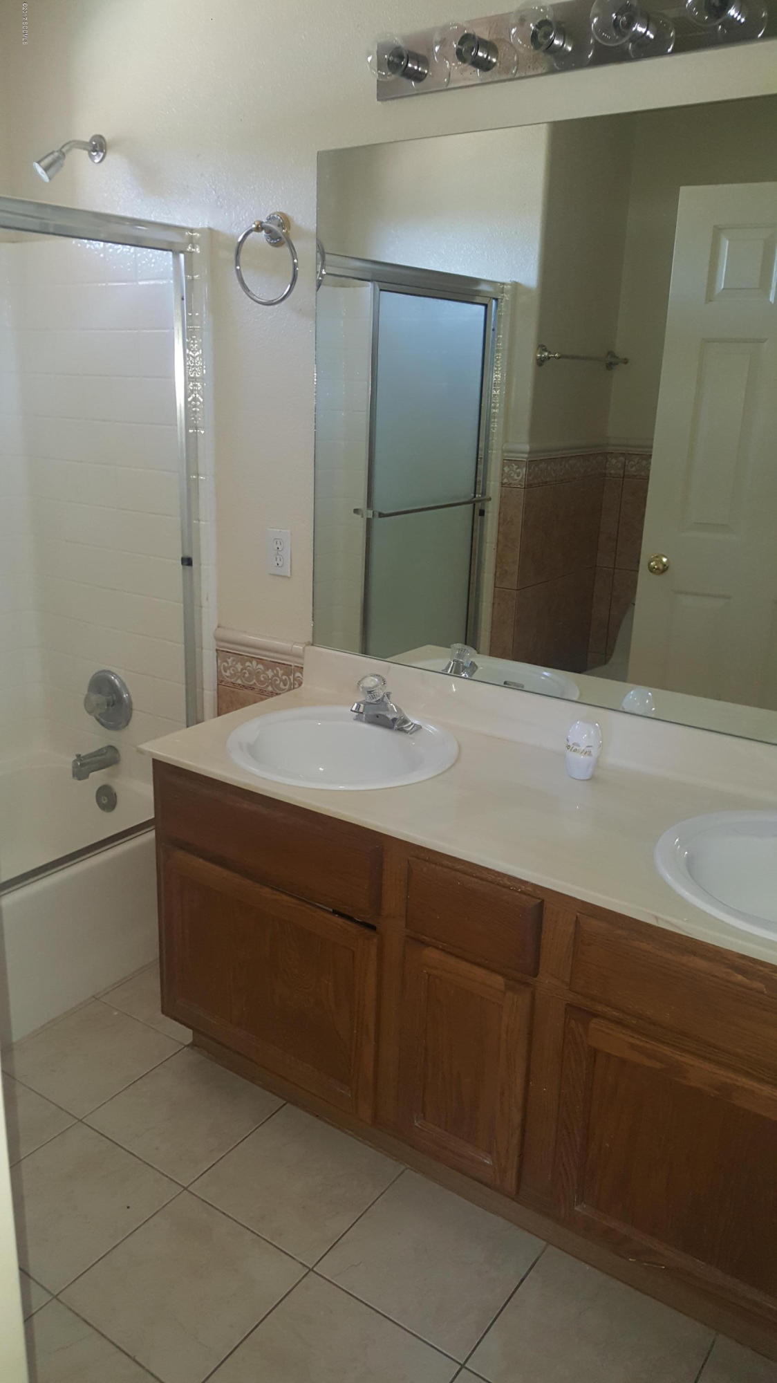 75 Highland Circle Rio Rico, AZ 85648 - Photo 17 of 19 a bathroom with a tub sink and mirror