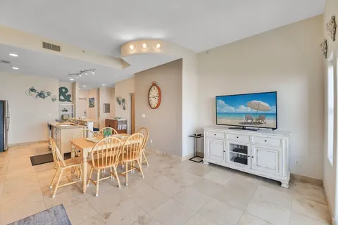 a view of a livingroom with furniture and a flat screen tv