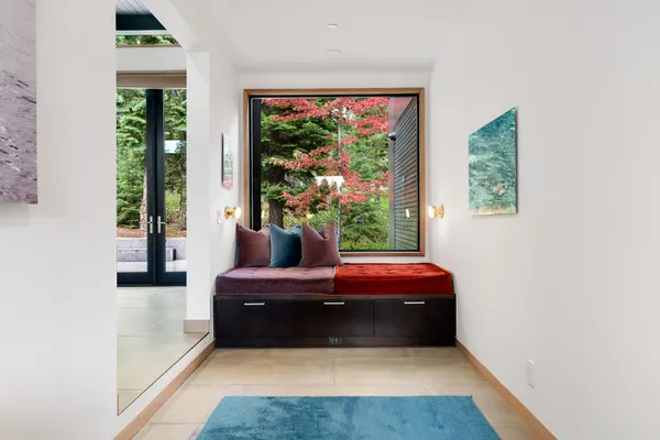 a living room with furniture and a potted plant