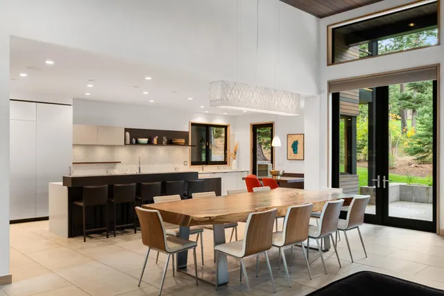 a dining room with furniture window and wooden floor