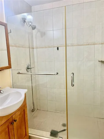 a white toilet sitting next to a wooden wall