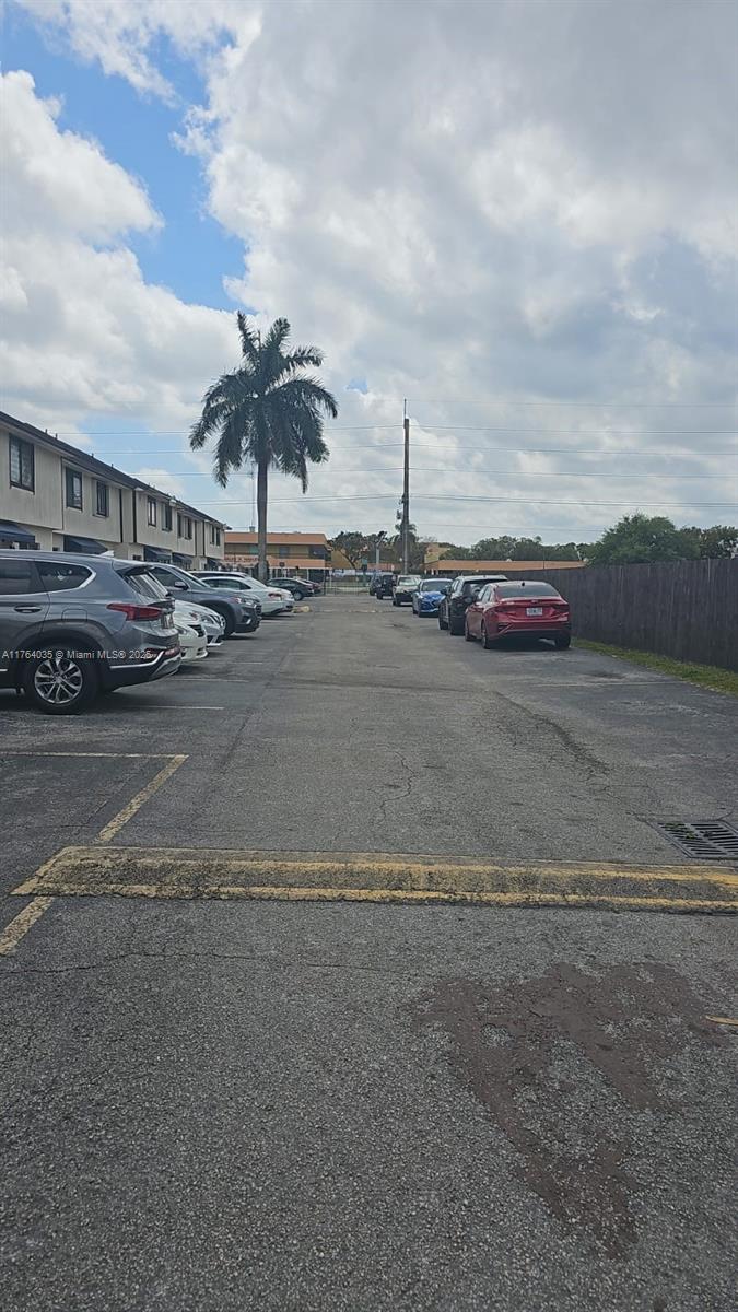 8430 Northwest 8th Street, Unit A11 Miami, FL 33126 - Photo 2 of 23 a view of a street with house