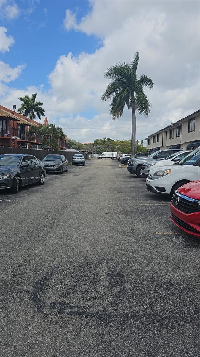 8430 Northwest 8th Street, Unit A11 Miami, FL 33126 - Photo 3 of 23 a view of street with cars