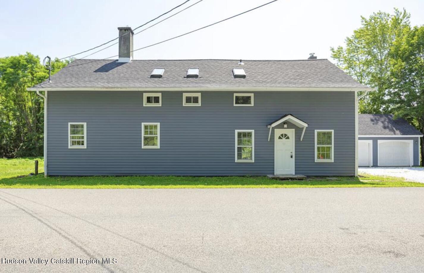 12 State Line Road Millerton, NY 12546 - Photo 2 of 11 a front view of house with yard and trees