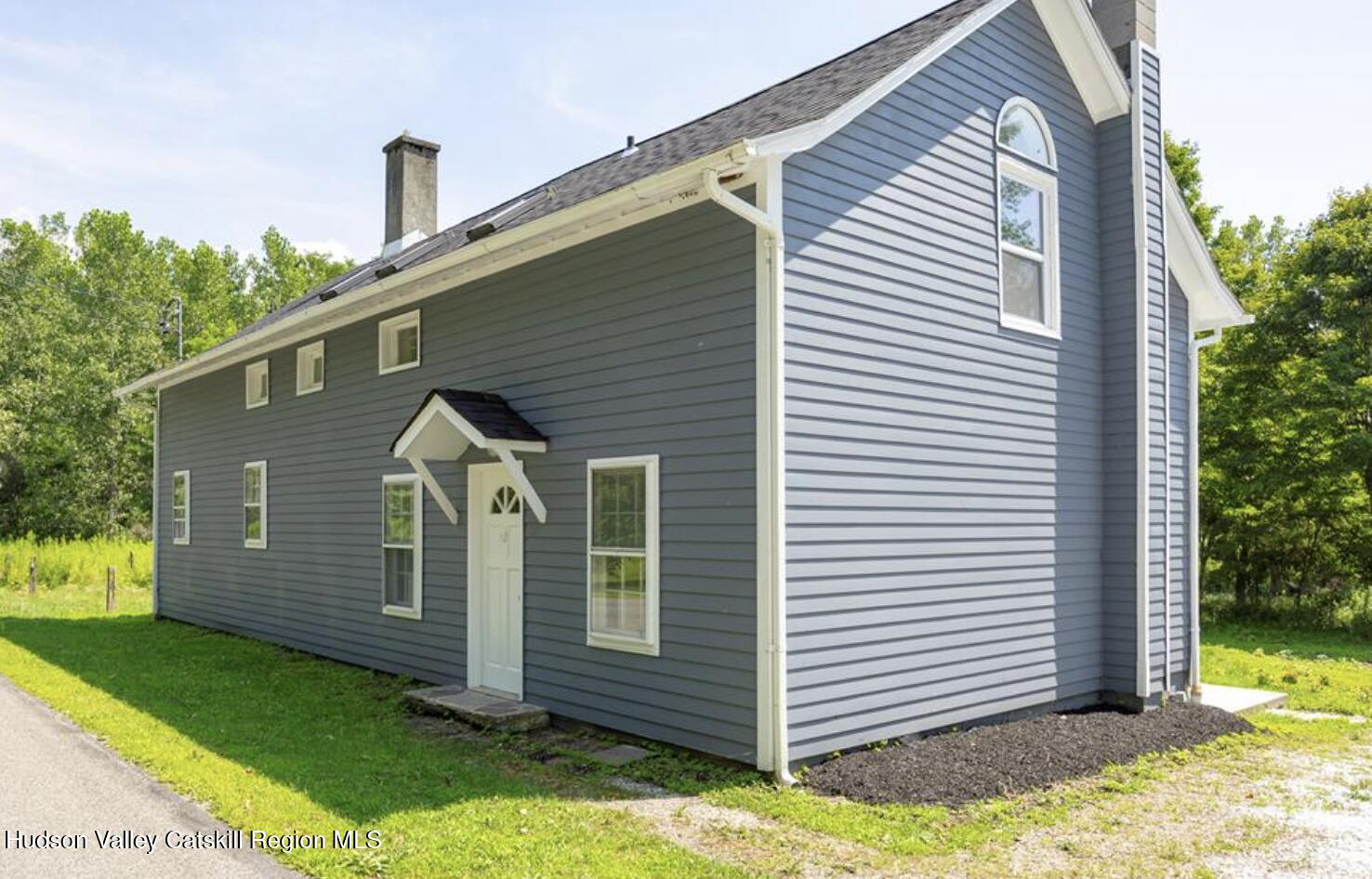 12 State Line Road Millerton, NY 12546 - Photo 3 of 11 a view of a house with a yard