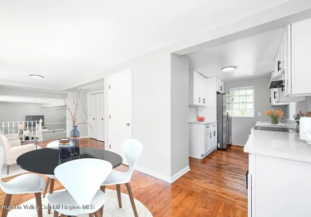 a view of a kitchen and dining room
