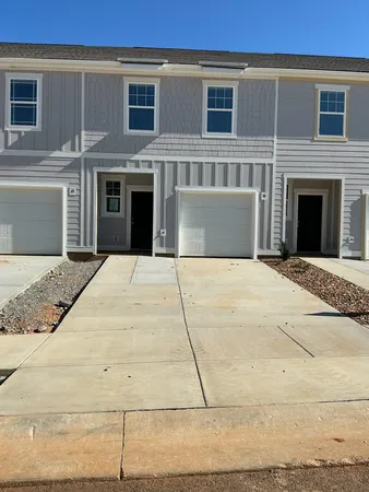 a view of house with yard