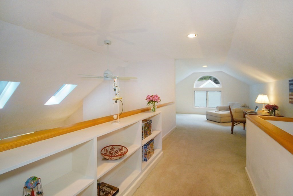 6 Winterberry Path, Unit 6 Acton, MA 01720 - Photo 11 of 24 a living room with furniture and a table