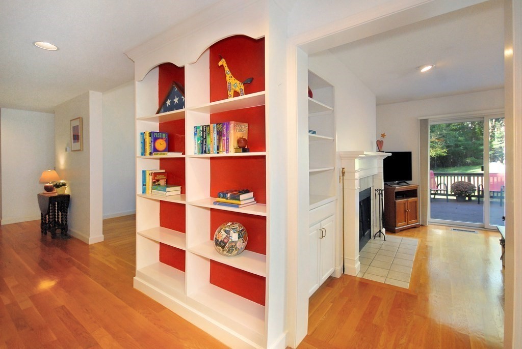 6 Winterberry Path, Unit 6 Acton, MA 01720 - Photo 14 of 24 a living room with furniture and a fireplace