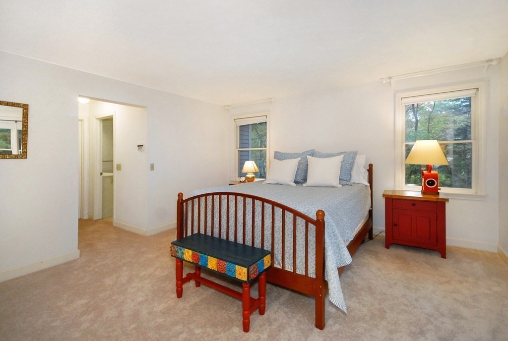 6 Winterberry Path, Unit 6 Acton, MA 01720 - Photo 16 of 24 a bedroom with a bed and window