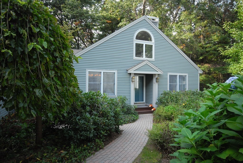 6 Winterberry Path, Unit 6 Acton, MA 01720 - Photo 2 of 24 a front view of house with green space