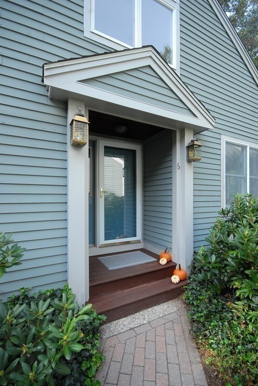 6 Winterberry Path, Unit 6 Acton, MA 01720 - Photo 24 of 24 a front view of a house with a small porch