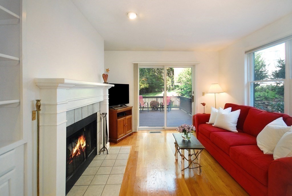 6 Winterberry Path, Unit 6 Acton, MA 01720 - Photo 5 of 24 a living room with furniture and a fireplace