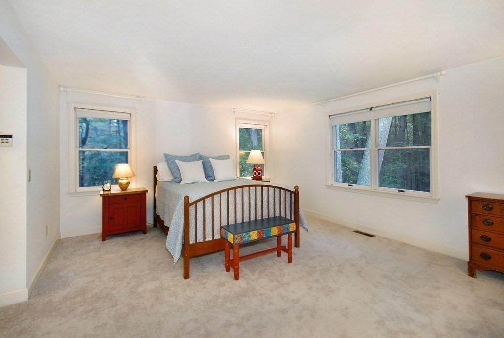 6 Winterberry Path, Unit 6 Acton, MA 01720 - Photo 6 of 24 a bedroom with furniture and a window