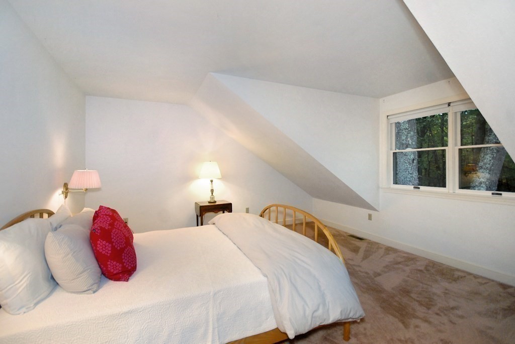 6 Winterberry Path, Unit 6 Acton, MA 01720 - Photo 8 of 24 a bedroom with a bed and a large window