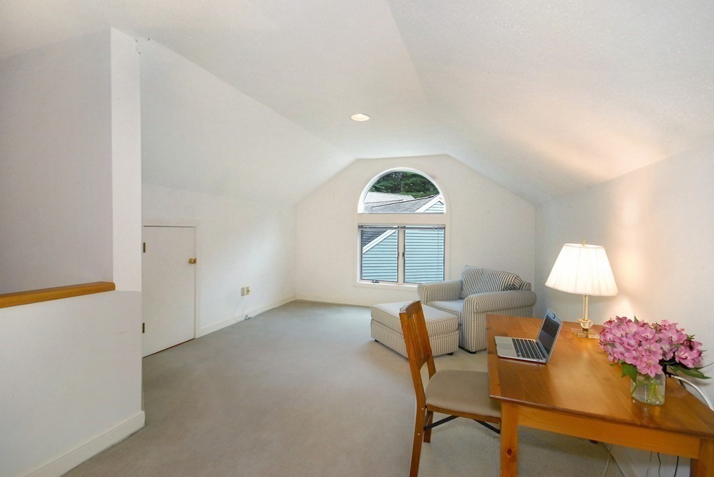 6 Winterberry Path, Unit 6 Acton, MA 01720 - Photo 9 of 24 a view of a room with furniture and a window