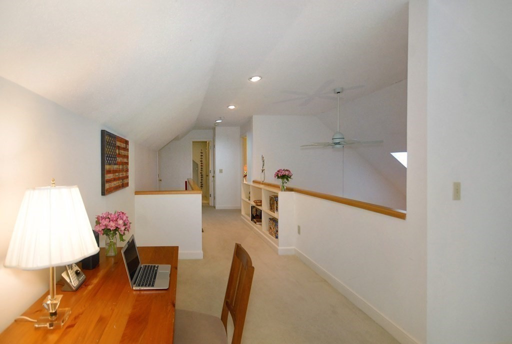 6 Winterberry Path, Unit 6 Acton, MA 01720 - Photo 10 of 24 a living room with furniture and a table
