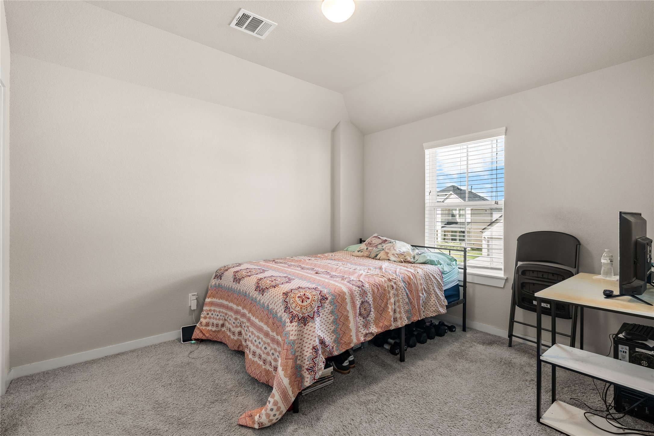 22939 Aspen Vista Dr Spring Spring, TX 77373 - Photo 23 of 29 This inviting secondary bedroom features vaulted ceilings, a functional layout, and plenty of space to personalize.