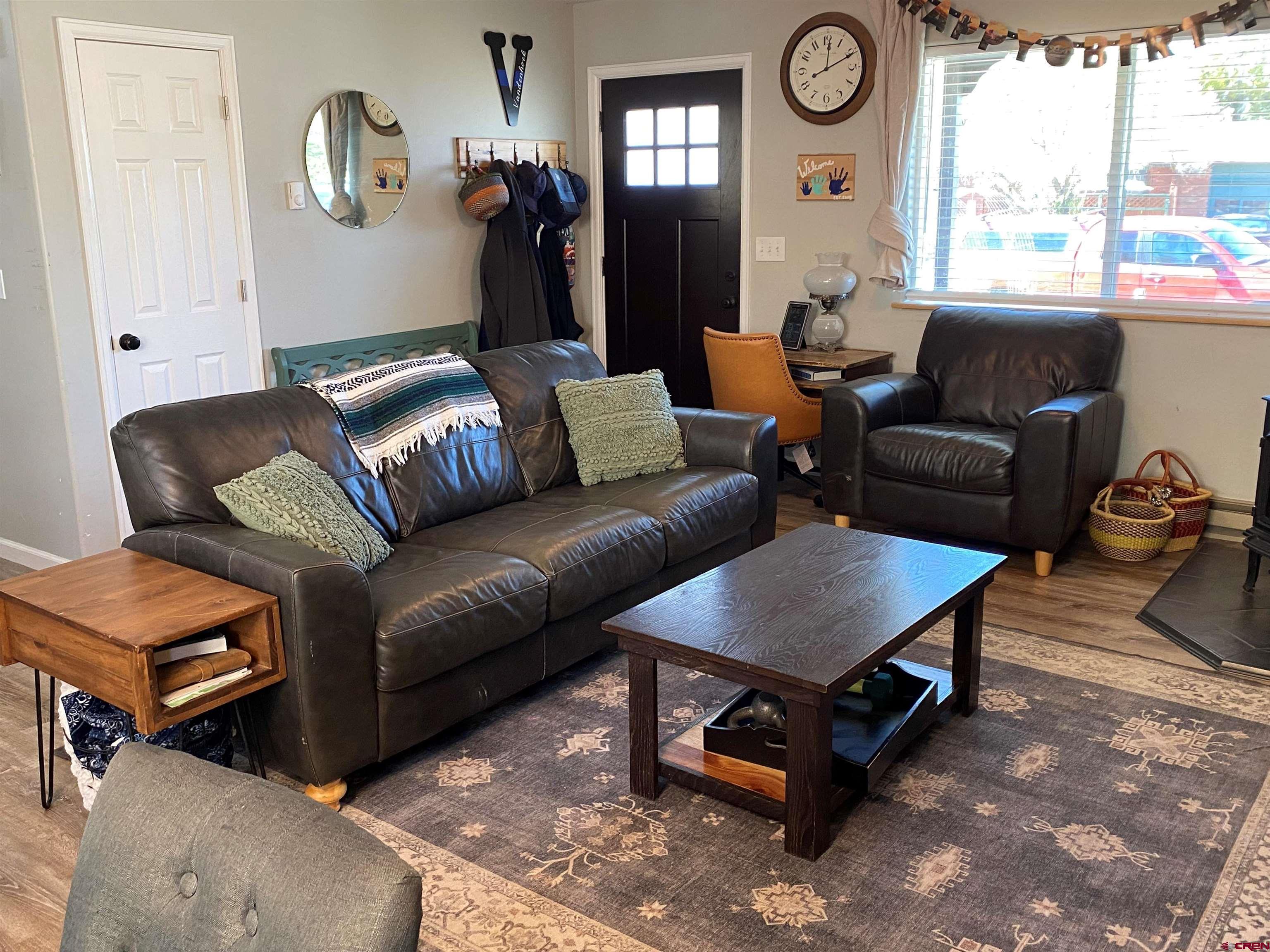 1861 Ouray Drive Montrose, CO 81401 - Photo 2 of 13 a living room with furniture and a large window