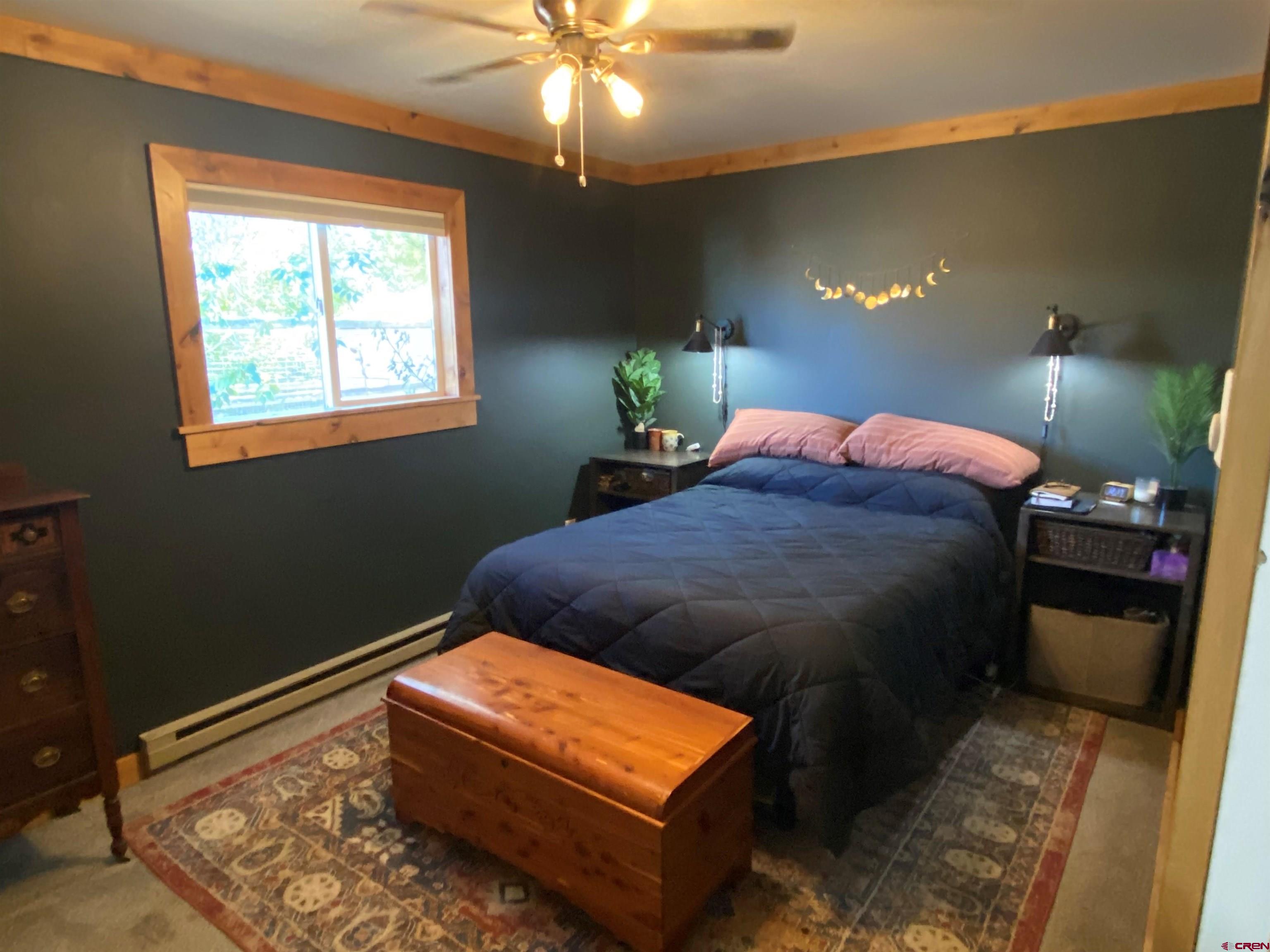 1861 Ouray Drive Montrose, CO 81401 - Photo 6 of 13 a bed sitting in a bedroom next to a window