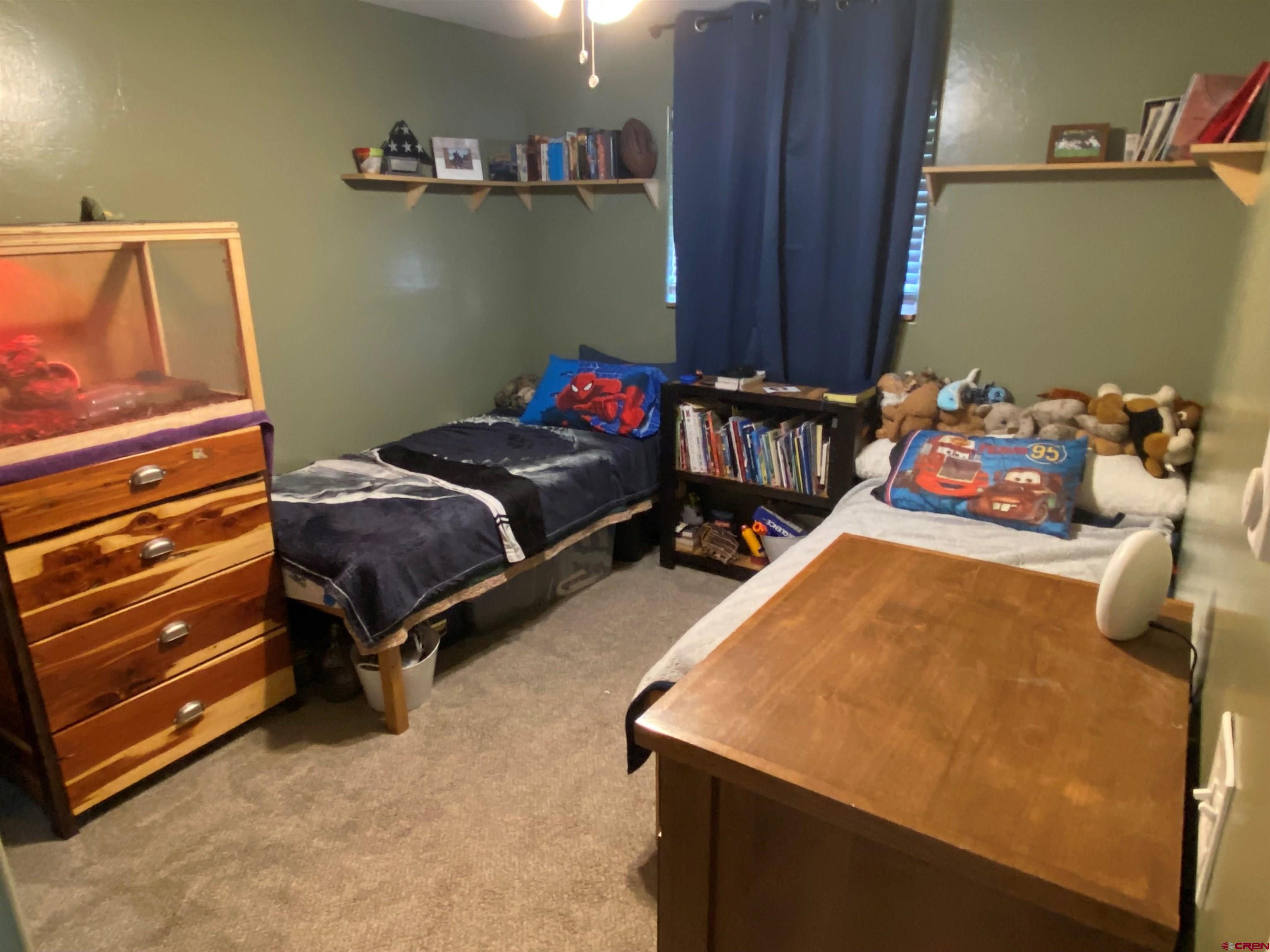 1861 Ouray Drive Montrose, CO 81401 - Photo 7 of 13 a bedroom with bed and a dresser