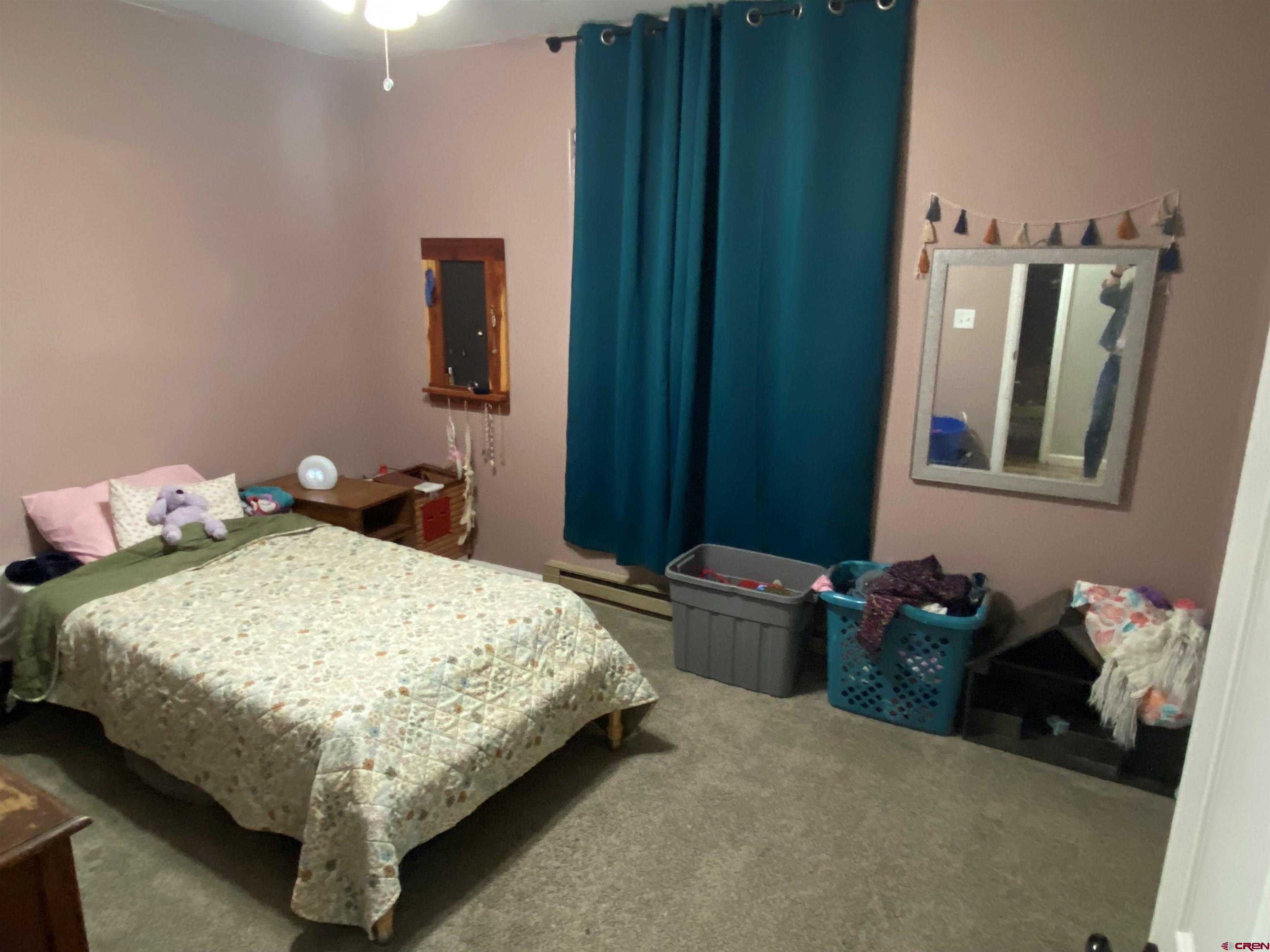 1861 Ouray Drive Montrose, CO 81401 - Photo 8 of 13 a bedroom with a bed and closet