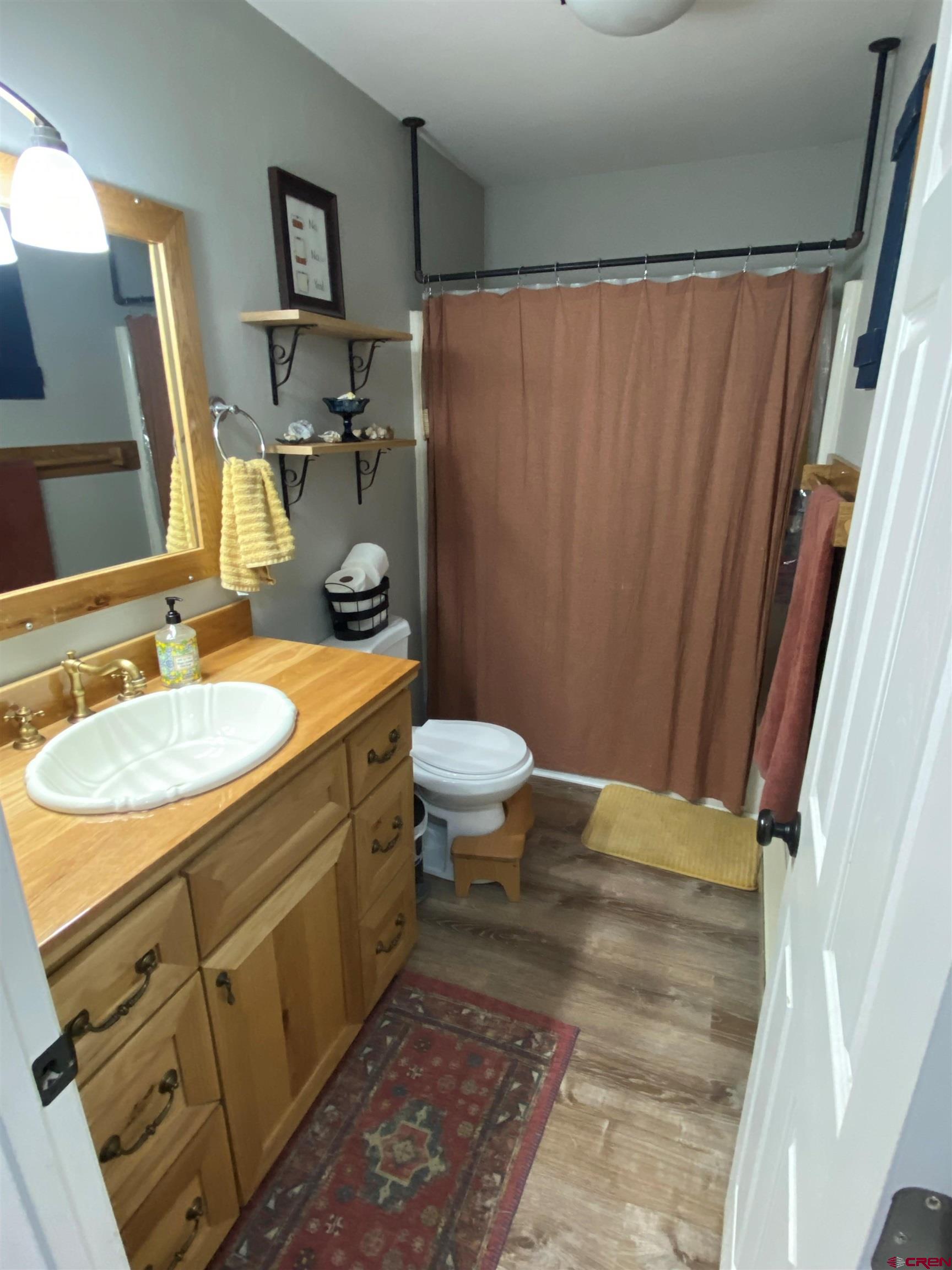 1861 Ouray Drive Montrose, CO 81401 - Photo 9 of 13 a bathroom with a sink toilet and shower