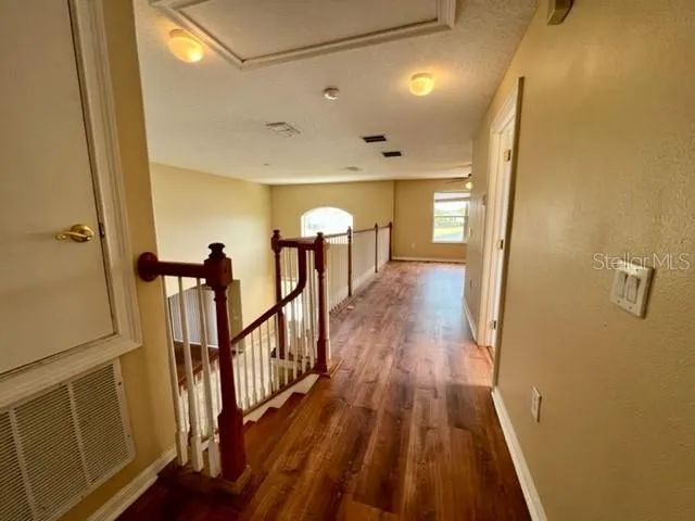 a kitchen with granite countertop a stove and cabinets
